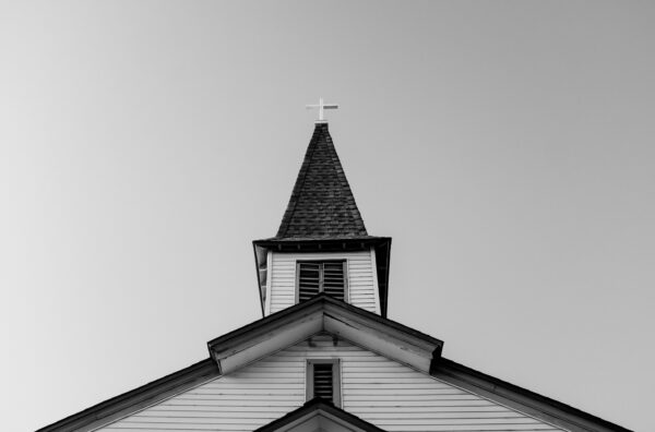 white and black concrete chapel in low angle photography
